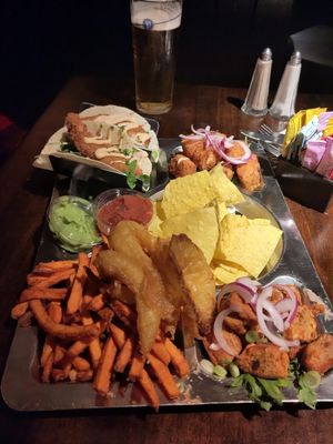 Vegan platter with cauli wings that they had run out of swapped out for tofu (top right), pint at rear for size comparison. This is the 2 person platter. Items as per next menu ima at Lavery's in Belfast