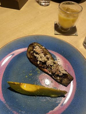 Eggpland with almond ricotta and walnut and a slice of grilled avocado. The juice is from the non-alcoholic drink menu.  at Ali Pacha in La Paz