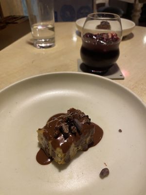 Second dessert of the 8 course menu: pudding (or a cake) with chocolate sauce and dried black olives.  at Ali Pacha in La Paz