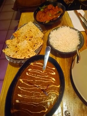Peshawari naan, dal makhni, rice, and chicken tikka masala. Sensational value in 2026 - just under $60! at Temple of Spices in Mermaid Beach