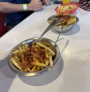 Loaded fries, nachos in background   at Comet 984 in Playa Del Carmen