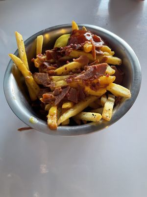 French fries with cheese and vacon   at Comet 984 in Playa Del Carmen