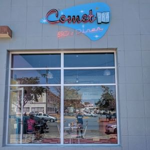 outside wall and neon sign at Comet 984 in Playa Del Carmen