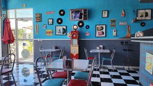 Cool 50s interior with old movies playing on the "TV" at Comet 984 in Playa Del Carmen