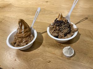 left is hazelnut praline frozen yogurt with cookie butter magic shell and Mexican wedding cookies, right is same yogurt with peanut butter magic shell, choc chips, cookies at Eb & Bean - Broadway in Portland