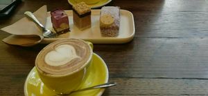 Cappuccino with oatmilk and vegan cakes at Broad Bean Organic Grocer in Southbank