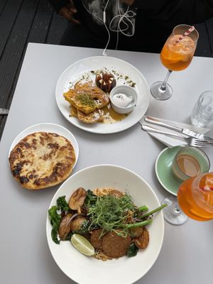 French toast (sourdough instead of brioche), paratha and potato’s & tempeh & satay & broccoli   at Buhler & Co in East London