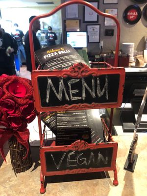 The menu stand at the front counter.   at Pizza Bell in Elk Grove