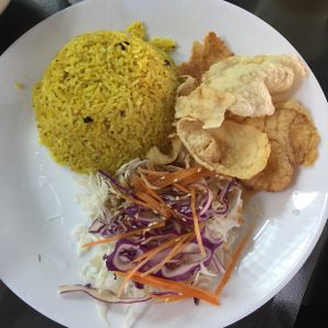 yellow rice with crackers and nice salad  at Vege Pot 素砂煲 in Central Singapore