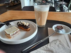 Latte with oat milk and 2 chocolate pastries (white chocolate and peanut) at Noordoever in Leuven