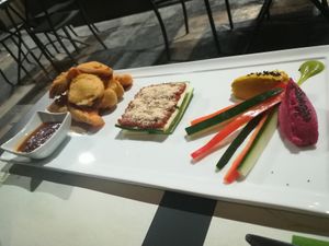 Tristarts (Fried Vegetables in Chickpea Batter, Raw Vegan Lasagna, Hummus) at Vitto Pitagorico in Naples