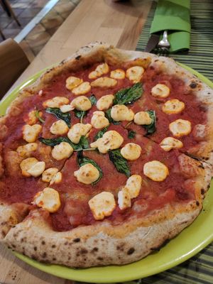 Vegan Margherita pizza with housemade cheese at Vitto Pitagorico in Naples