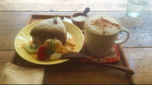 soymilk chai latte and carrot cake w/ coconut cream + assorted fruits. at k u p u in Shunan