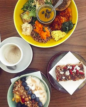 Brunch on Sunday with the big savory plate, the coconut yoghurt bowl and the granola bar with a drizzle of chocolate, coconut flakes and goji berries on top. at Ou Bien Encore in Geneva