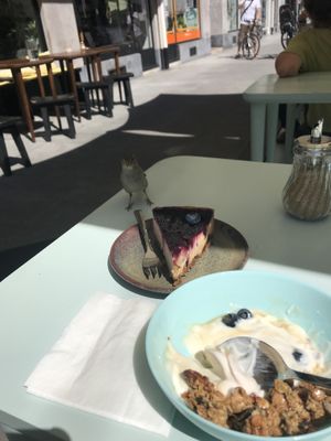 Even my little feathered friend liked the cheesecake at Ou Bien Encore in Geneva