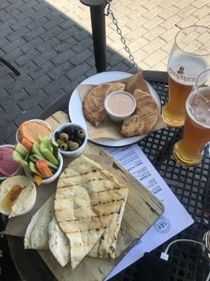 Hummus platter and cheese bagel at Alchemia od Kuchni in Krakow