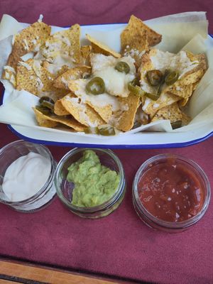 Loaded nachos with sour cream, guacamole and salsa at The Dice Cup in Nottingham