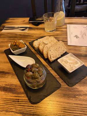 Bites (toast with garlic mayo, carrot, and olives) at Estudio Vegetariano in Lagos