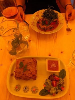 Vegan Lasagne & rice-filled peppers with roasted rocket 👍🏽 at Estudio Vegetariano in Lagos