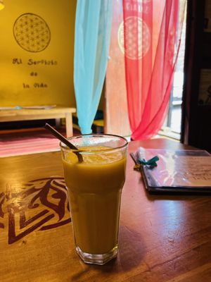 Entrance and juice  at The Vegan Temple by Prasada in Cusco