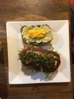 Lentil burger with mustard and pesto sauce  at The Vegan Temple by Prasada in Cusco