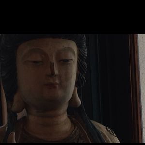 Buddha near seating at The Natural Cafe - Hitchcock Way in Santa Barbara