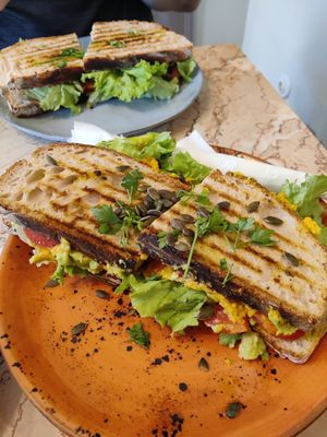 XL toast (was huge) with mashed chickpeas, avocado, tomato, lettuce, marinated red onion. This was delicious! at Saudade in Sintra