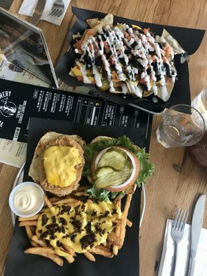 Bacon and cheese fries, chicken burger, & nachos at Bar Vegandale in Toronto