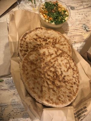 Hummus (side) with extra pita at Shouk in Washington