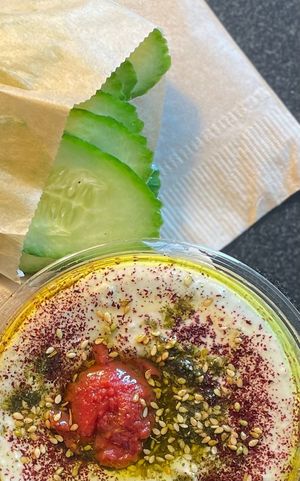 Hummus with tomato jam and cucumber slices at Shouk in Washington
