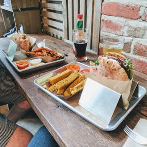 Cauliflower pita, sweet potato fries, & not-so-light beer; shouk burger, polenta fries, & light beer at Shouk in Washington