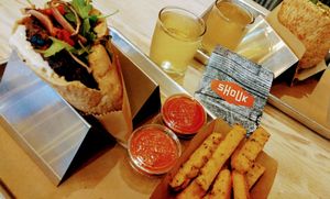 To burgers, wine, and fries.  Happy vegans!!! at Shouk in Washington