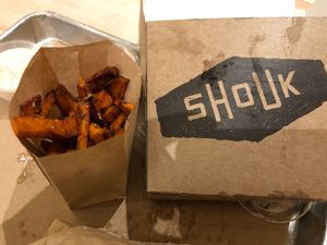 Shouk burger and sweet potato fries  at Shouk in Washington