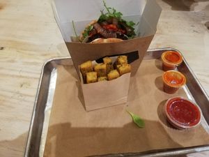 Mushroom burger in pita with polenta chips! at Shouk in Washington