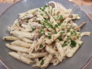 penne with vegan pesto and soy cream at Brasserie Forestiere in Bruges