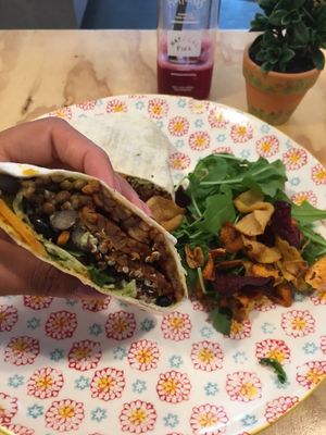The vegan bean burrito with hummus and tempeh. Amazing taste!  at The Happiness Cafe  in Eindhoven
