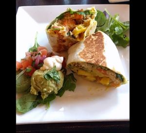Breakfast burrito:
seitan chorizo, cashew cheese, tofu scramble, roasted potatoes, quinoa, spinach and hollandaise. served with guacamole salad #Veganuary at Graze in Nashville