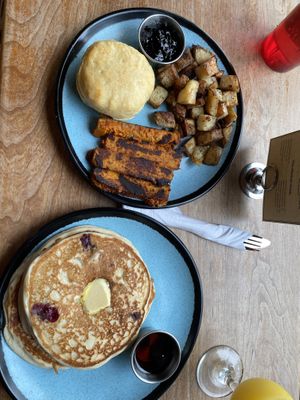 Blueberry pancakes (also gluten free), potatoes, tempeh bacon and a biscuit.  at Graze in Nashville