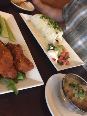 Con papas burrito, mashed potatoes with gravy on the side and hot wings  at Graze in Nashville