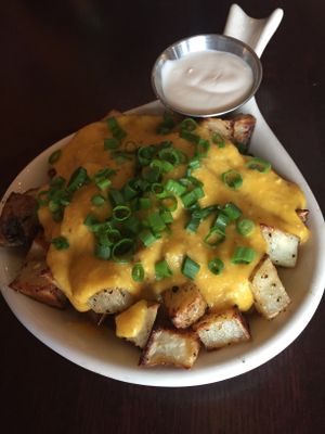 Home fries with cashew cheese sauce and homemade sour cream at Graze in Nashville