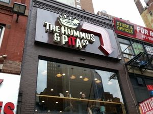 outside at The Hummus and Pita Co in New York City