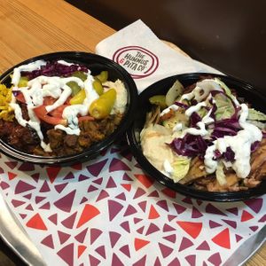 The vegan shawarma bowl with hummus, Spanish eggplant, Lebanese cauliflower, tomatoes, red cabbage, pickles and hot peppers at The Hummus and Pita Co in New York City