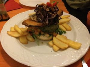 vegan burger with  caramelised onions, breaded aubergine, and spinach pattie at Dolmen Bar in Lanzarote