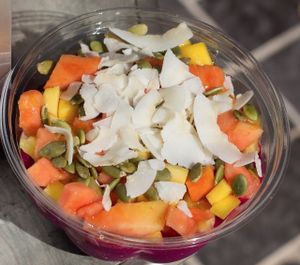Pitaya Bowl with mango, papaya, banana, pineapple, coconut flakes, pumpkin seeds and honey.  at SpaJuiceBar in Fort Lauderdale