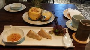 Macadamia & pineapple fried rice and vegetable spring rolls. at Uu Dam Chay in Hanoi