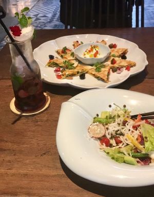 So good! Non-alcoholic blueberry mojito, quesadilla, and jicama salad.  at Uu Dam Chay in Hanoi
