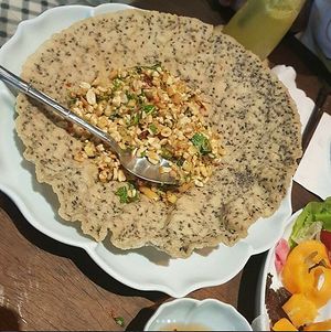 Hue style dish (stir-fried tofu % mushroom served with crispy rice pancake) at Uu Dam Chay in Hanoi