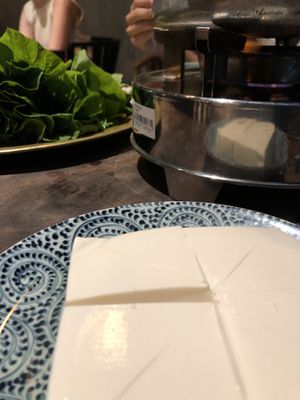 Fresh tofu going with the mushroom hot pot.  at Uu Dam Chay in Hanoi