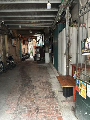 Go inside this street   at Om Hanoi in Hanoi