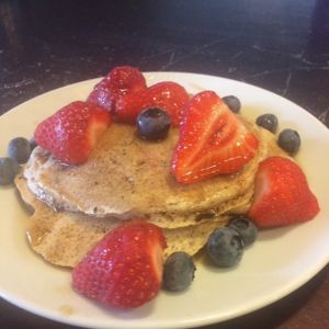 Vegan pancakes with fruit and maple syrup at PerryLicious Coffee and Cake Rooms in Teignmouth